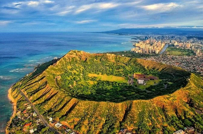 An aerial view of Diamond Head crater with the city behind